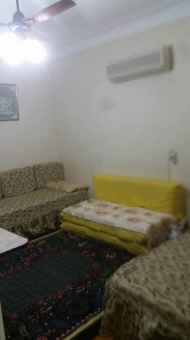 the yellow sofa is expandable to a full bed
