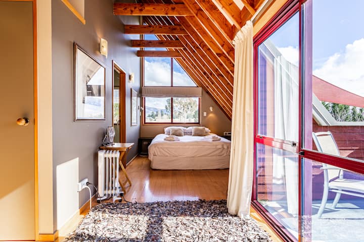 King Size Bed, with a balcony  with views across to the Remarkables plus ensuite
