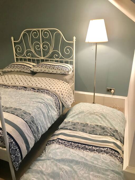 Bedroom 1 set up to host three guests