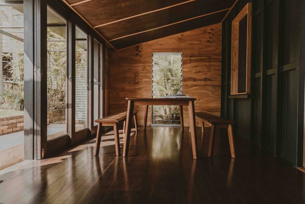 Dining/back deck that opens up to the backyard.