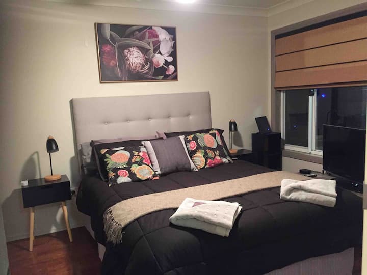 Queen bedroom with Apple TV