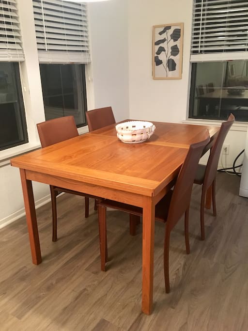 Dining room includes expandable table which can be extended to seat 10