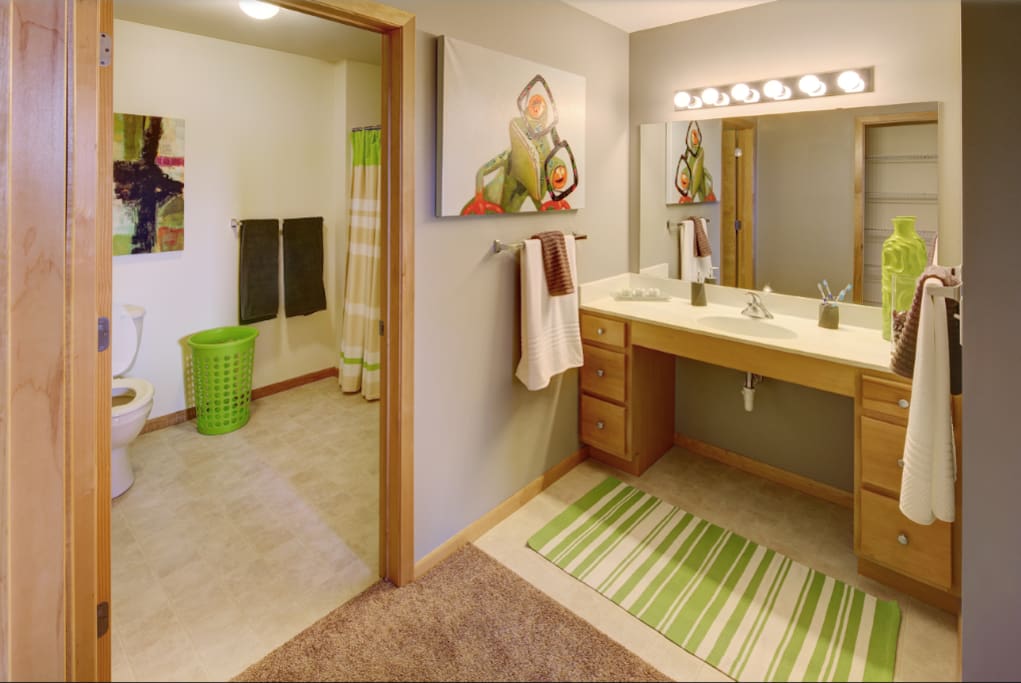 Vanity/full bath area seperated by door