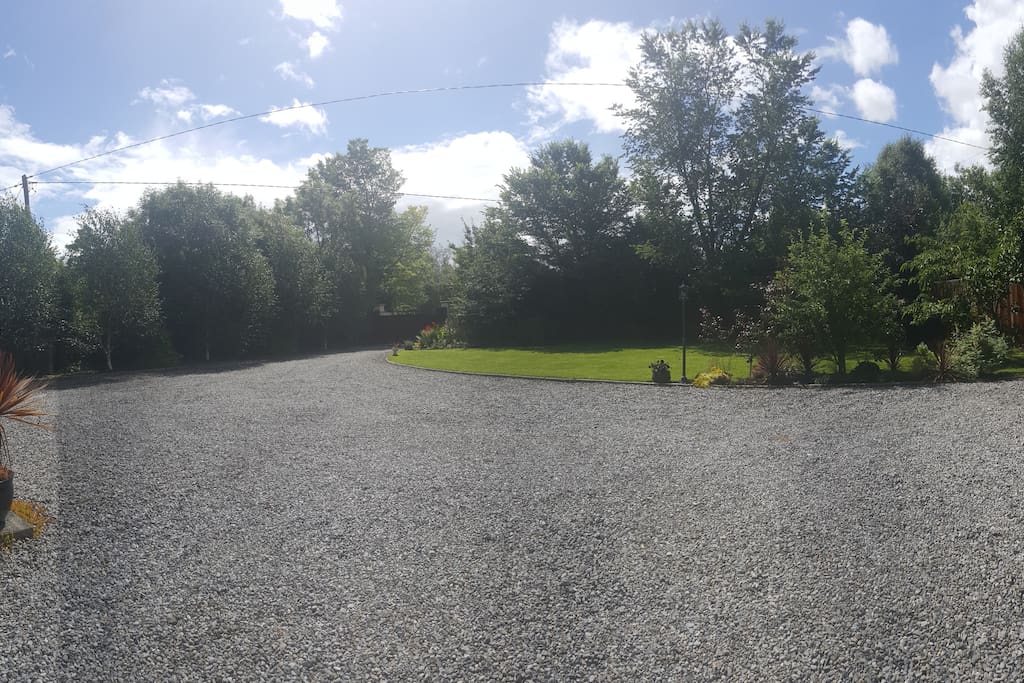 The view from your room, is our garden with secure spacious parking .