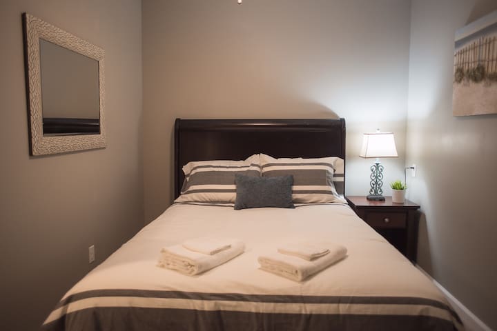 Basement bedroom, shared bathroom and kitchenette