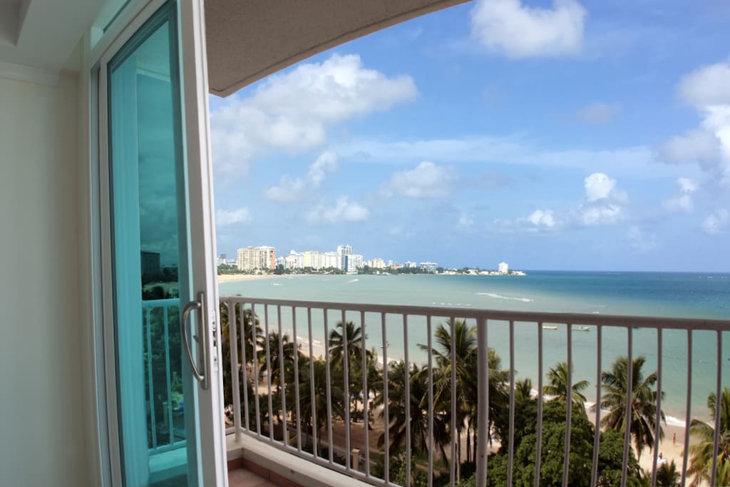 View from inside the apartment of the balcony & ocean.
