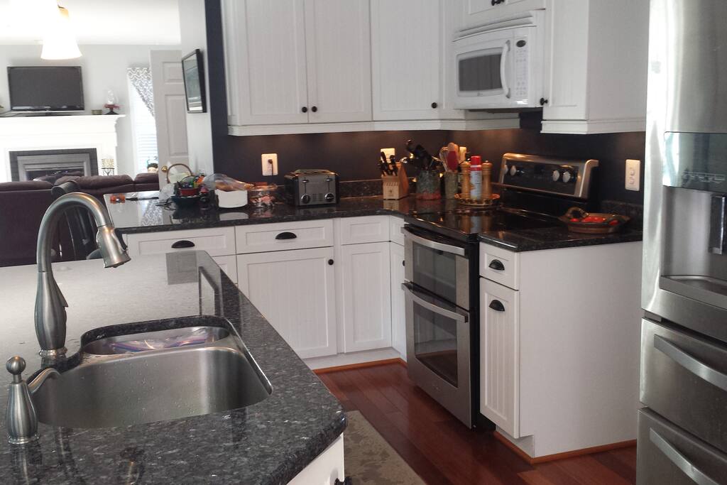 House kitchen next to family room.