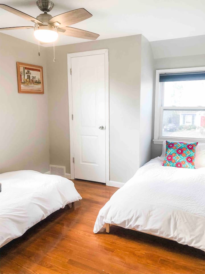 Twin bedroom with 2 single beds. Bed frames can also be stacked to make one taller bed. 100% cotton bedding. Adjustable speed ceiling fan. Room-darkening shade. Closet. Located on 2nd floor.