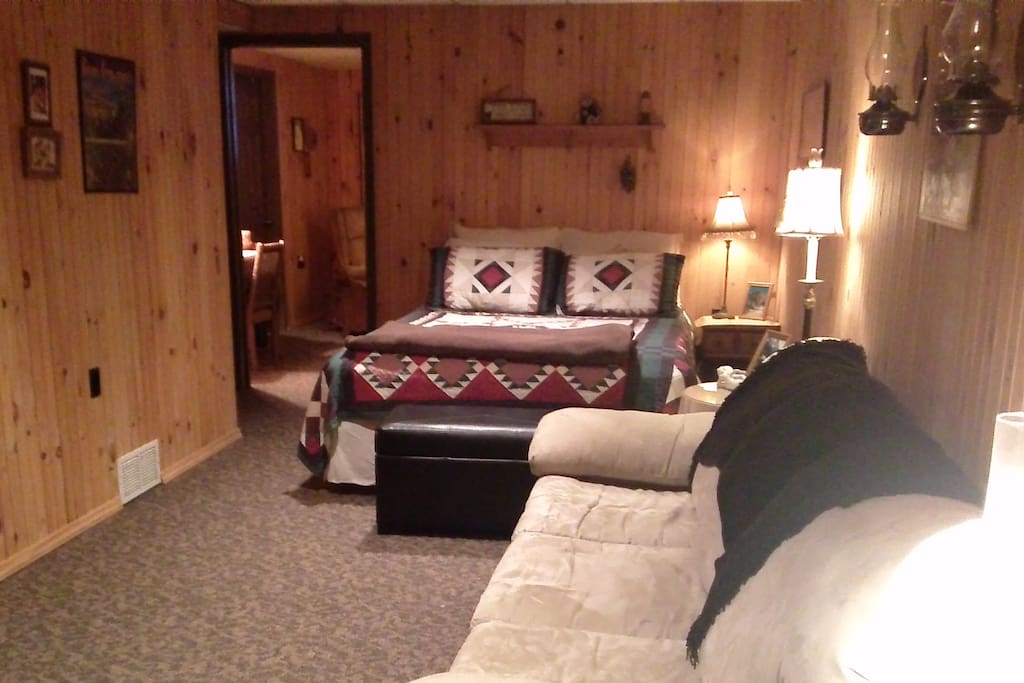 The sleeping area of Bedroom 1--a queen bed.