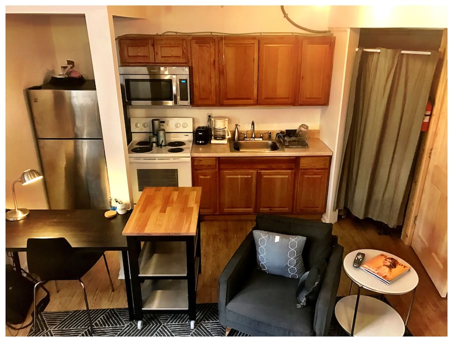 Humble kitchen, office, and lounge space in the studio.