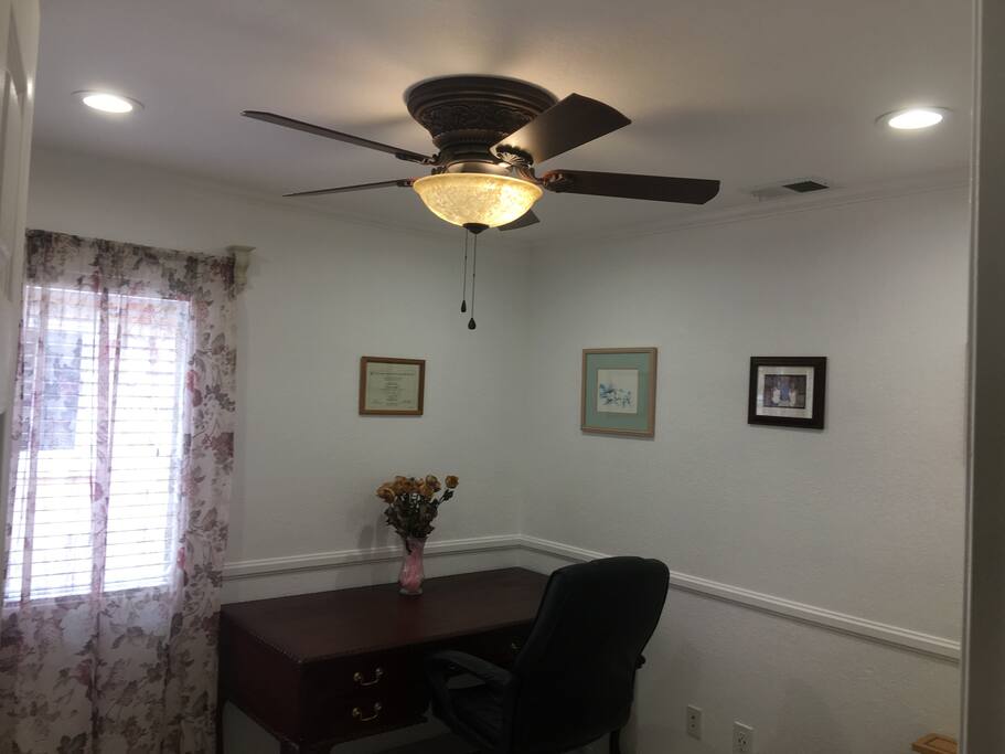 small bedroom with desk table