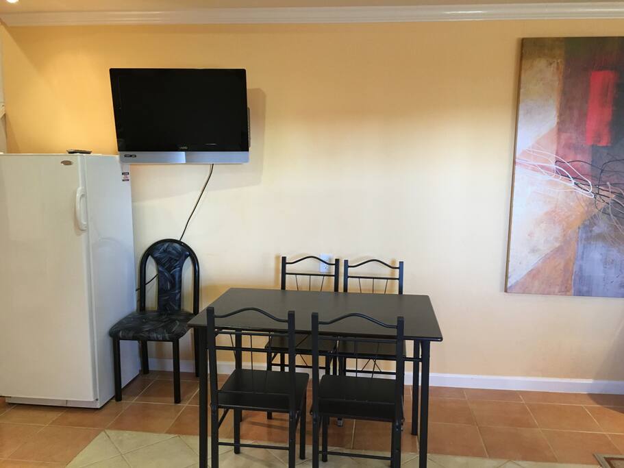 HD TV, table and refrigerator