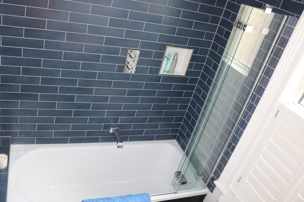 Private bathroom, adjacent to bedroom, with shower, bath, basin, toilet