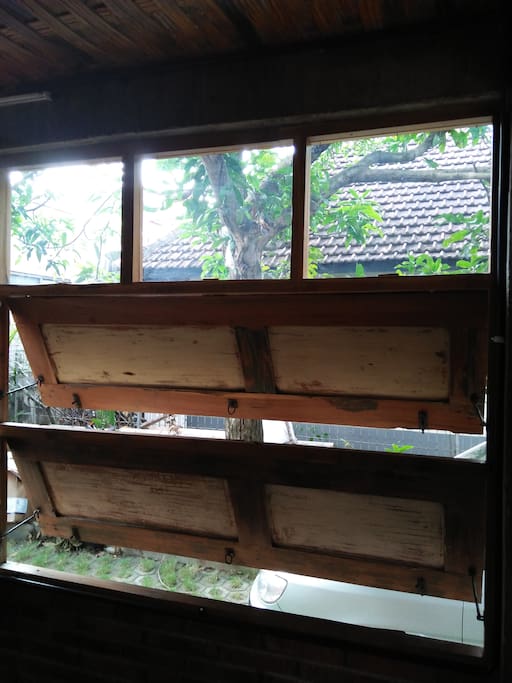 one of many old wooden windows to give you breeze to cool the room