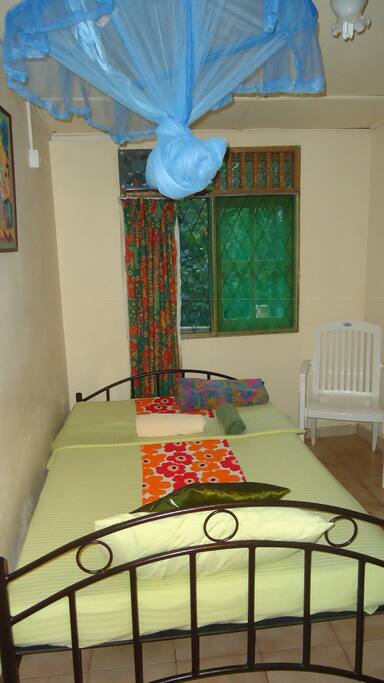 Room with mosquito netting.