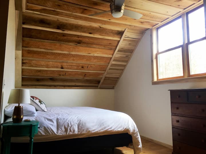Comfortable king bed in main upstairs bedroom.