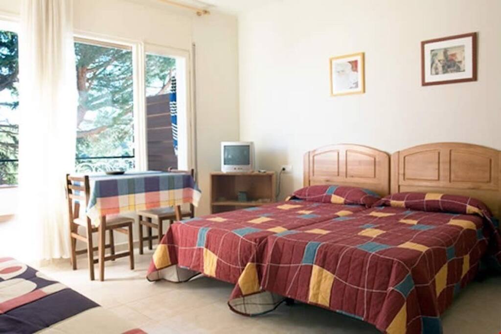 The bright living area features either a double bed or 2 twin beds, please specify any bedding preferences with our team!