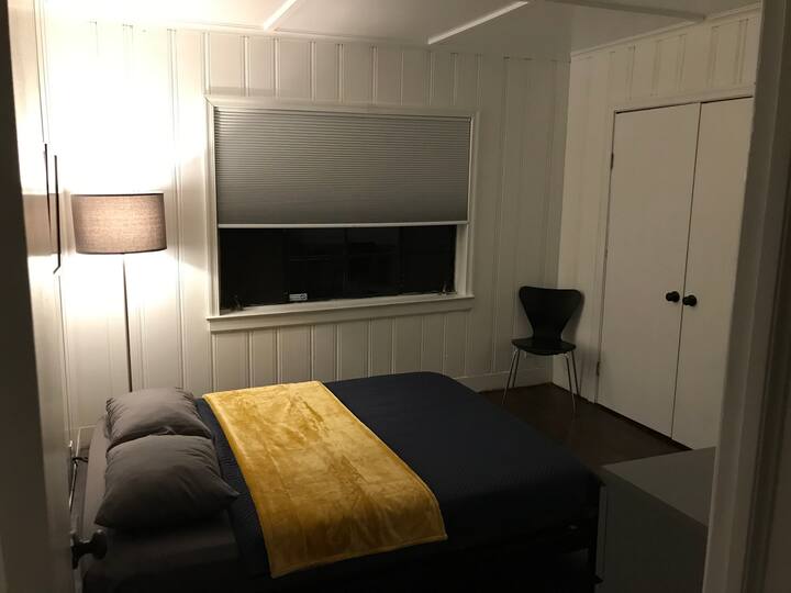 Bedroom 1. Includes a dresser, desk,  and a firm memory foam mattress.