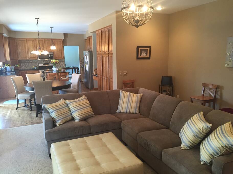 Spacious family room and adjacent kitchen that opens up to the deck with gas grill.