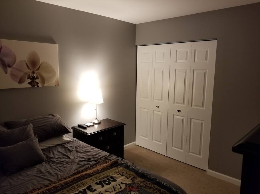 Closet, bed and nightstand.