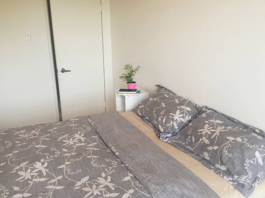 Guest bedroom with comfy queen bed.