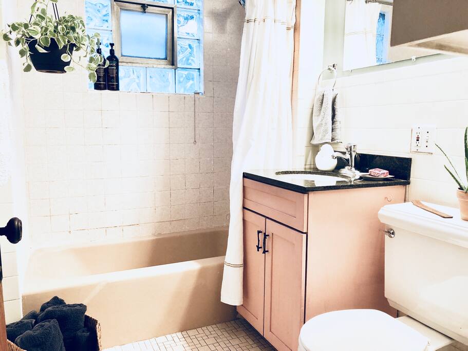 This is a photo of your bathroom. It is stocked with plenty of shower, hand, and small towels. We also have a hair dryer for you to use and will provide quality shampoo and bath products.