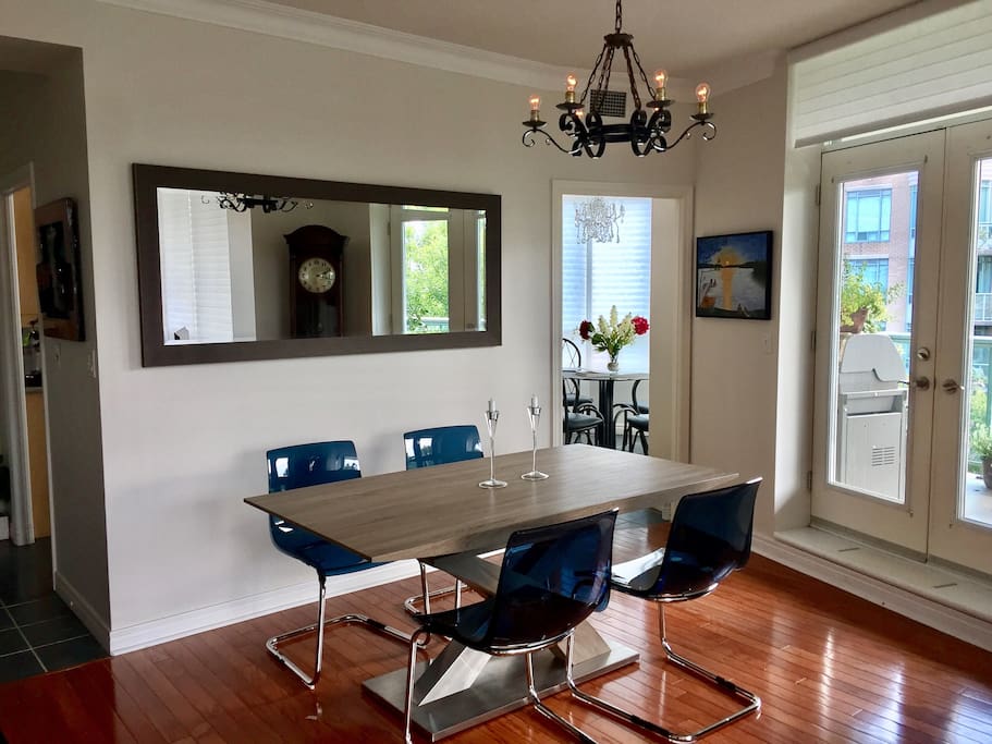 Modern dining area with seating for 8 while you look out windows with a 270 degree view