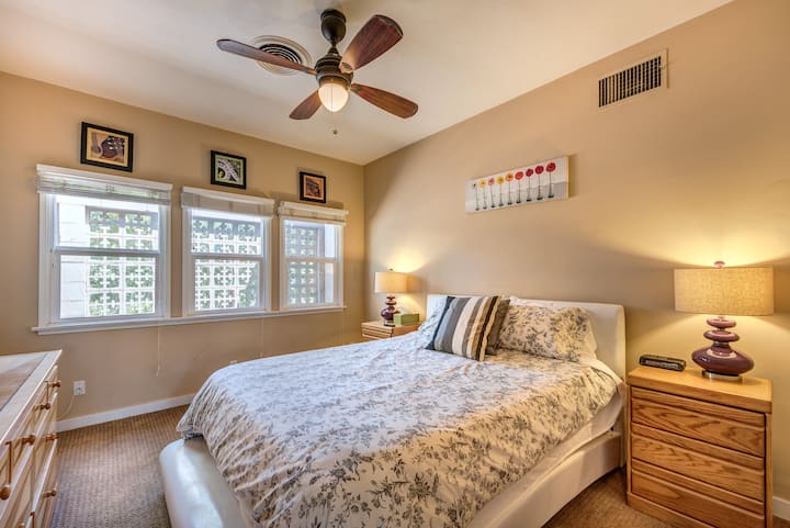 Garden facing guest bedroom with Queen size bed