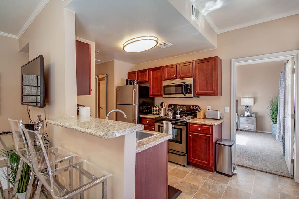 Beautiful modern kitchen with a bar table for two, covering all of your basic cooking needs.