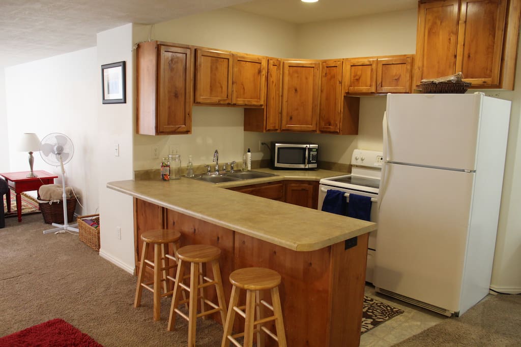 Well stocked kitchen for cooking and eating. Full size fridge. Sorry no dishwasher available.