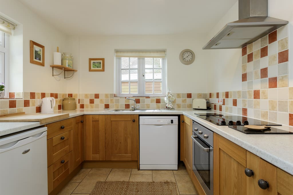 Everything to hand in the well laid out oak fronted kitchen