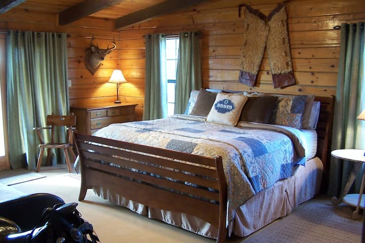Cowboy king in the Bunkhouse features a King bed, a twin with trundle and a set of bunkbeds. This room sleeps up to 6.