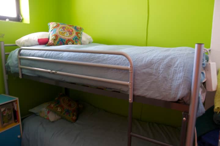 Small bedroom with bunk bed, ideal for children