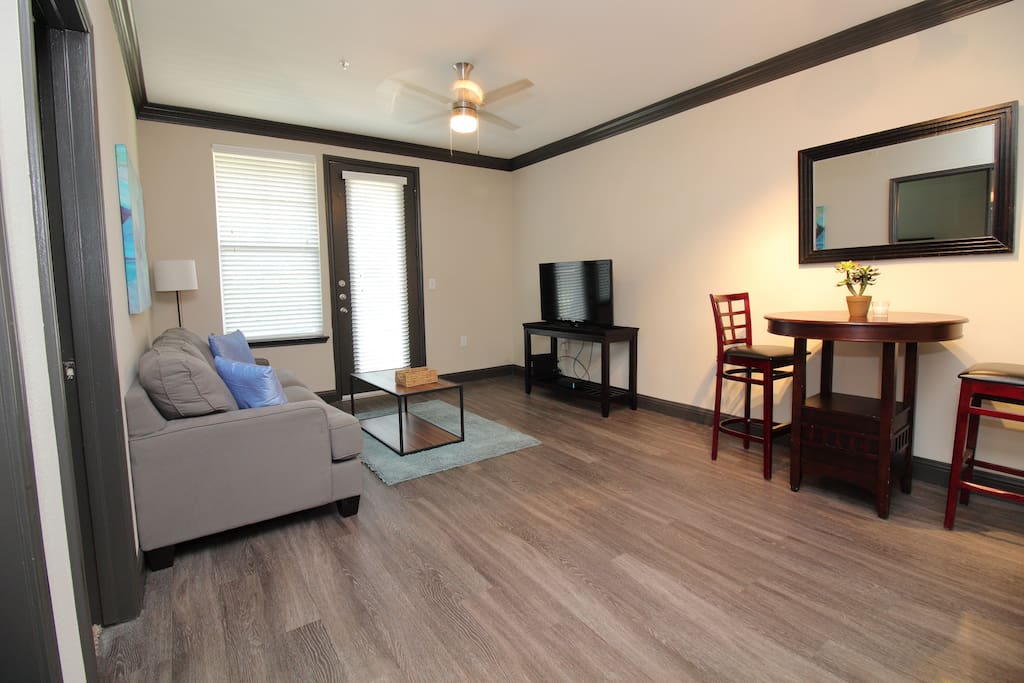 Living room area with 105+ MBPS Wi-Fi Cable Internet and 140+ channels premium cable and local TV channels