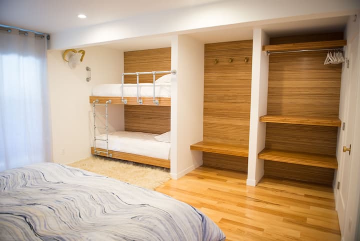 custom built-in bunks and closets with open shelving