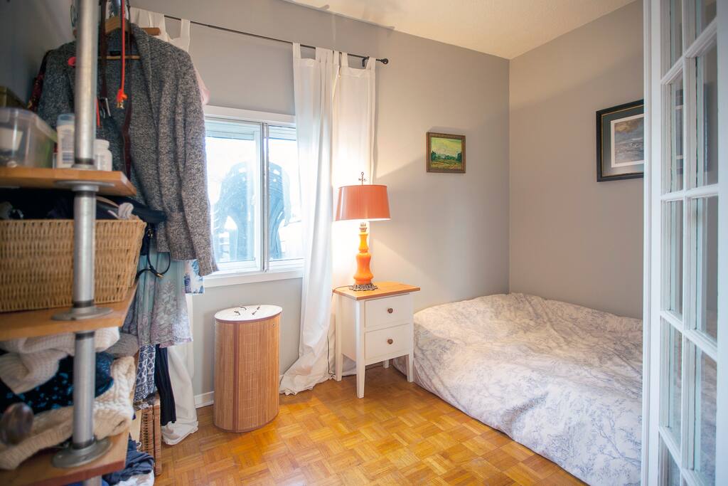 The bedroom is nice and quiet, with soft sun in the morning. The bed is a mattress on the floor (frame wouldn't fit up the narrow stairs, and now I actually prefer it). It's an extra long queen size.