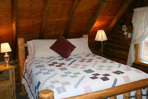 Stay in a real log house on a family farm!