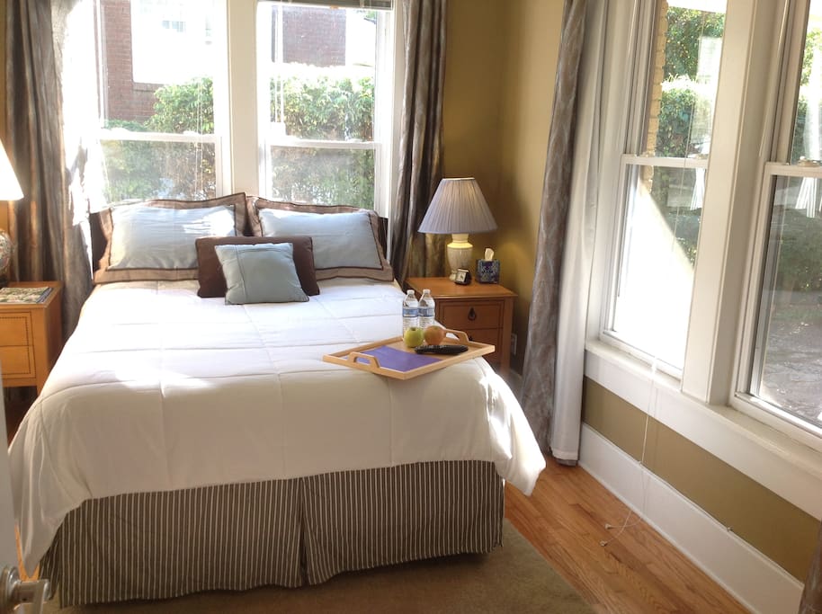 Comfortable, private queen size bedroom in sunny room, but with blinds and curtains for privacy and good sleeping.