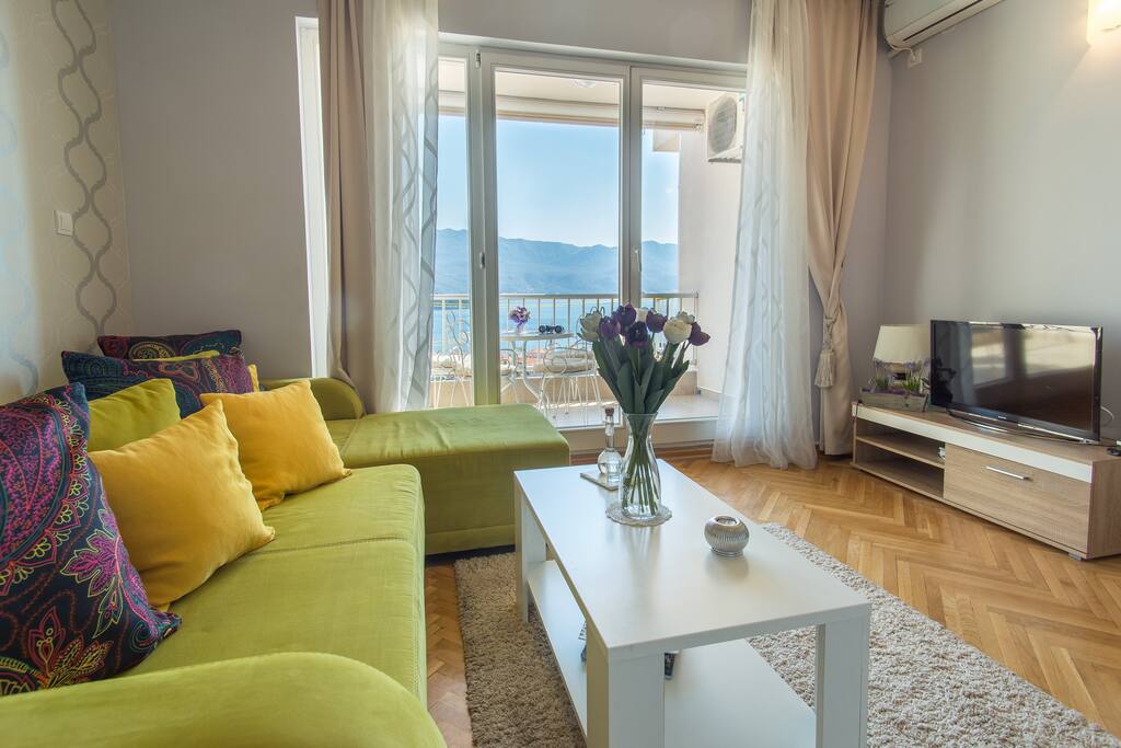 Dinning room with a balcony and see view