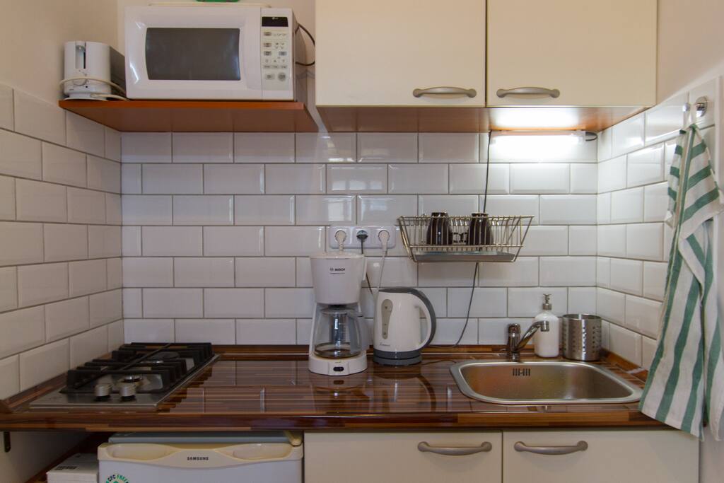 Equipped with all the basics. You can make yourself simple meals, all the necessary kitchen stuff is there.