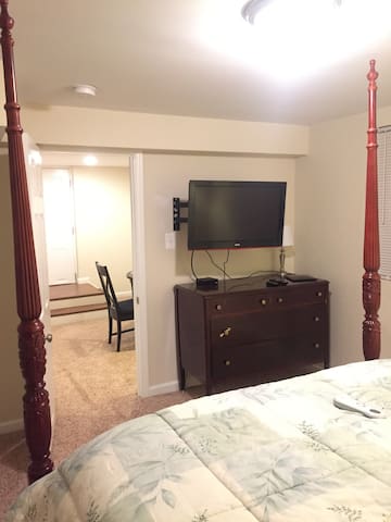 Basement with living room, bedroom, and full bath