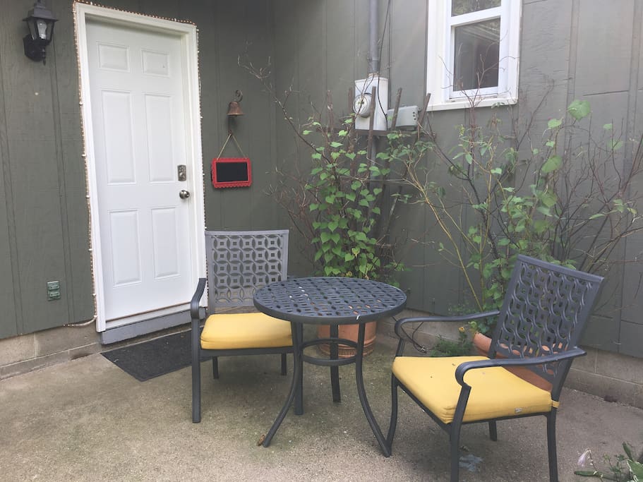 Small table and chairs near front door.