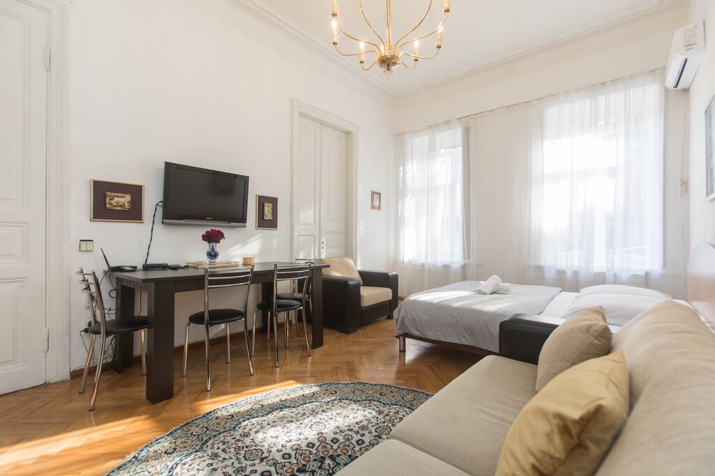 "The apartment is charming, with high ceilings, gilt lights, and tall windows with wooden panels that close over them (helpful for jet lag)"