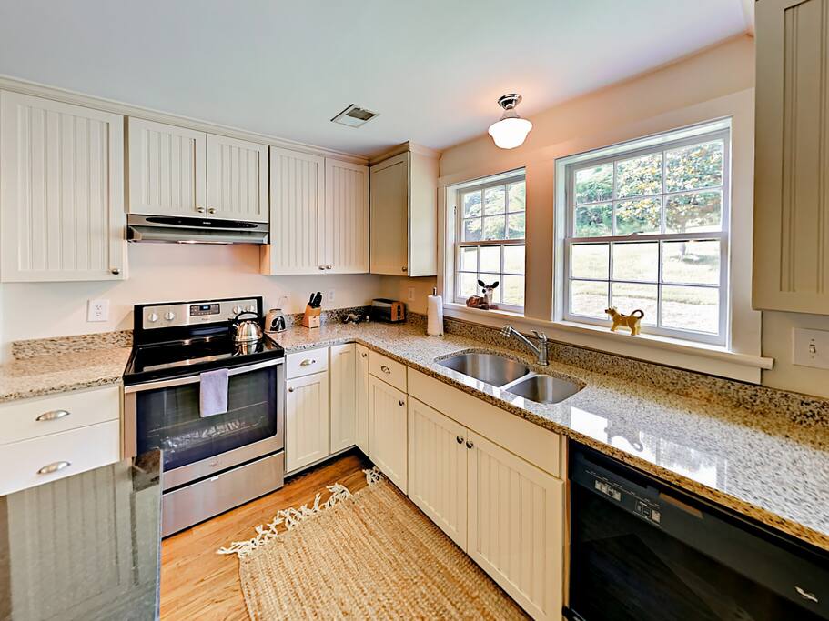 Stainless steel appliances adorn the modern kitchen