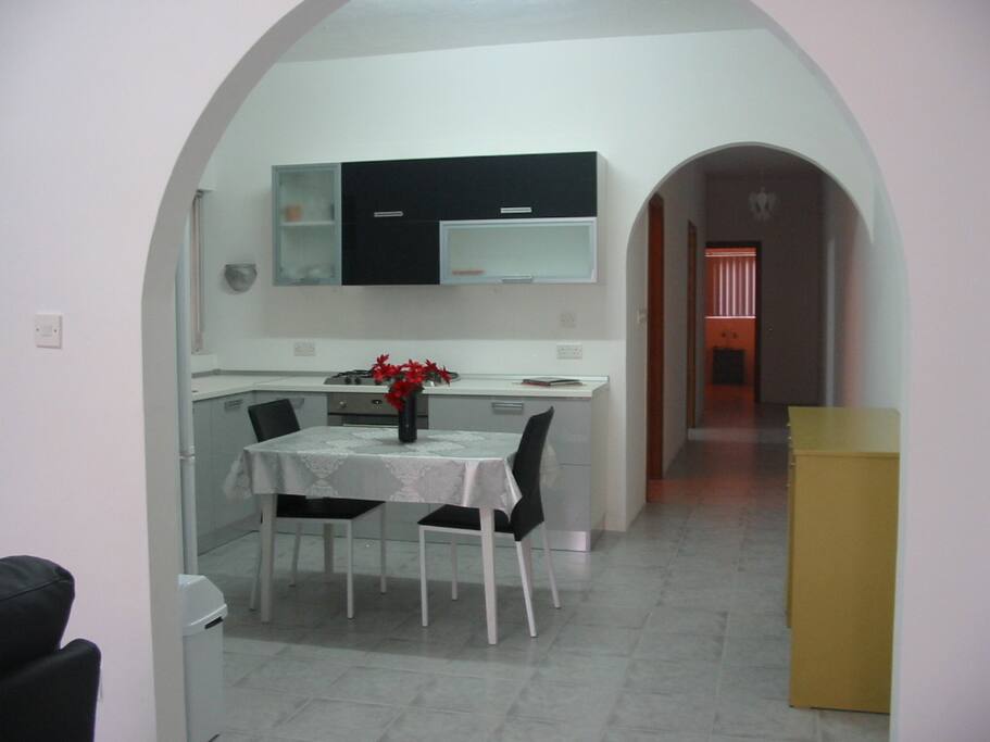 Bright and modern kitchen at front of house.