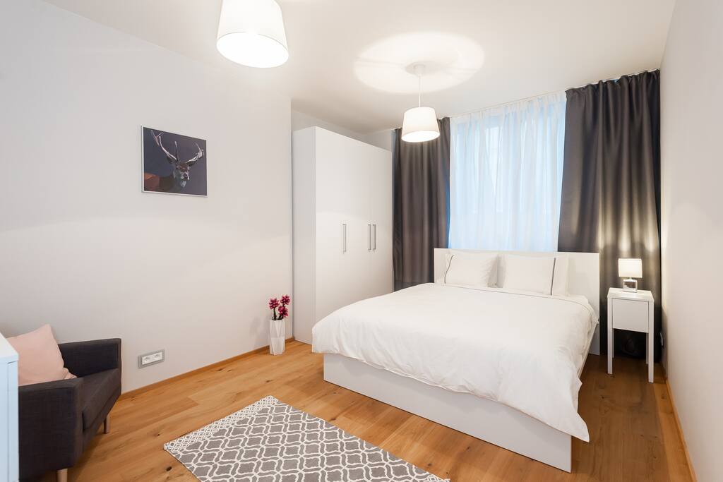 Second bedroom with double bed, air-condition, sofa, wardrobe and a drawer