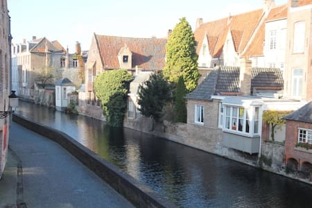 Golden hand, charming canal view