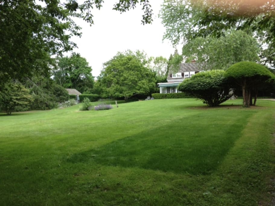 Cottage to left of main house. View coming from road and down driveway.