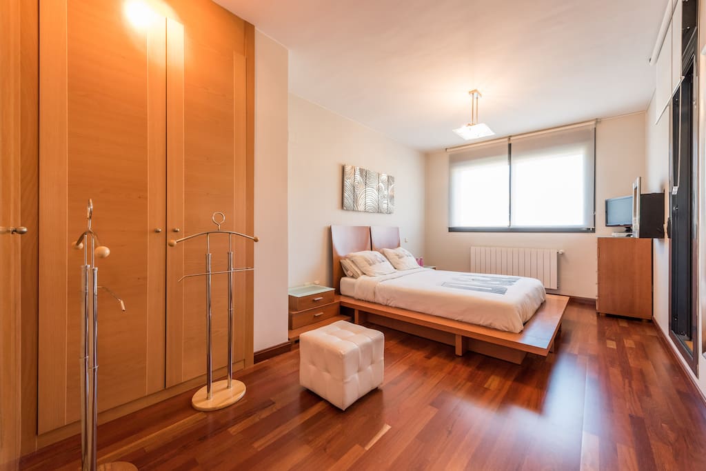 Your spacious and bright bedroom with motorized blackout roll down shutters, TV (with Chromecast) and electric fireplace @ Sierra de Madrid