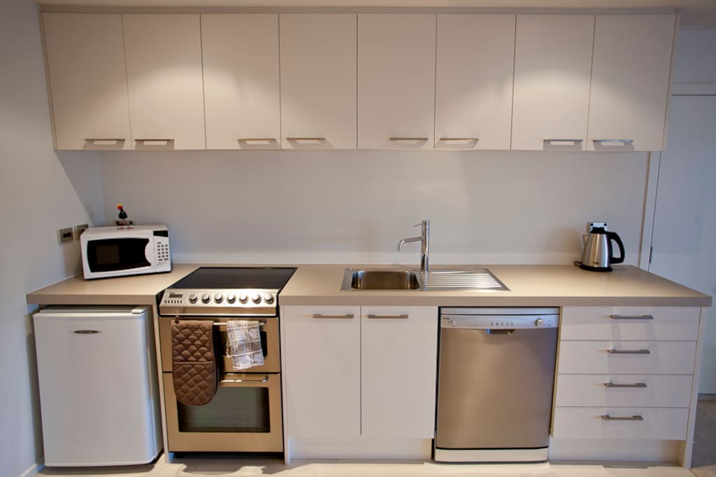 Fully fitted kitchen, including dishwasher, fridge, cooker, hob & microwave